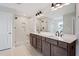 This bathroom offers a double vanity, modern fixtures, and a glass enclosed walk in shower at 94 Black Walnut Dr # 201, Garner, NC 27529
