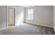 This bedroom offers neutral decor, carpet, and a window to let in the natural light at 94 Black Walnut Dr # 201, Garner, NC 27529