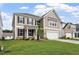 Charming two-story home with a manicured lawn, attached garage, and classic curb appeal at 94 Black Walnut Dr # 201, Garner, NC 27529
