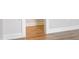 Hallway featuring hardwood floors and white trim at 94 Black Walnut Dr # 201, Garner, NC 27529