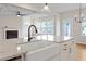 Well-equipped kitchen with a farmhouse sink and granite countertops at 94 Black Walnut Dr # 201, Garner, NC 27529