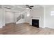 Spacious living room boasts hardwood floors, fireplace, coffered ceilings and open staircase at 94 Black Walnut Dr # 201, Garner, NC 27529