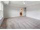 Bright main bedroom features neutral decor, carpet, a ceiling fan, and an en suite bathroom at 94 Black Walnut Dr # 201, Garner, NC 27529