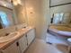 A double sink, soaking tub, and neutral paint make this bathroom ready to be enjoyed at 94 S Waters Edge Ln, Henderson, NC 27537