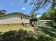 A side view shows a well-maintained home and yard at 94 S Waters Edge Ln, Henderson, NC 27537