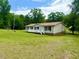 Single-story home with a front porch, well-maintained lawn, and a serene atmosphere at 94 S Waters Edge Ln, Henderson, NC 27537