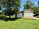 Single-car garage with white door on a verdant lot, ideal for storing your vehicle at 94 S Waters Edge Ln, Henderson, NC 27537
