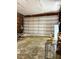 Spacious garage with a large door, suitable for a workshop or vehicle storage at 94 S Waters Edge Ln, Henderson, NC 27537