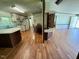 Open kitchen area with a breakfast bar, leading into the dining area at 94 S Waters Edge Ln, Henderson, NC 27537