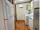 Practical laundry room with washer, dryer, and ample storage space at 94 S Waters Edge Ln, Henderson, NC 27537