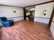 Comfortable living area with hardwood floors and ample natural lighting at 94 S Waters Edge Ln, Henderson, NC 27537