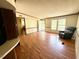 A well-lit living area features hardwood floors and access to the exterior of the home at 94 S Waters Edge Ln, Henderson, NC 27537