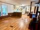 Open living area with wood flooring, creating a warm and welcoming atmosphere at 94 S Waters Edge Ln, Henderson, NC 27537