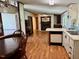 Cozy living room featuring wood floors and a fireplace with mirror at 94 S Waters Edge Ln, Henderson, NC 27537
