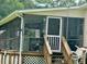The screened-in porch offers a tranquil view and allows for comfortable outdoor living at 94 S Waters Edge Ln, Henderson, NC 27537