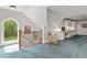 This bonus room features a small wet bar, staircase and beautiful views of the backyard at 9940 Koupela Dr, Raleigh, NC 27614