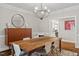 Dining room with hardwood floors, modern lighting, and stylish decor at 9940 Koupela Dr, Raleigh, NC 27614