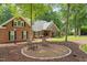Well-maintained brick home with a cozy outdoor seating area at 9940 Koupela Dr, Raleigh, NC 27614