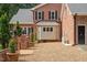 Beautiful brick home featuring a lush backyard, patio, and well-manicured landscaping at 9940 Koupela Dr, Raleigh, NC 27614
