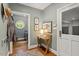 Entryway features hardwood floors, modern decor, and access to laundry and garage at 9940 Koupela Dr, Raleigh, NC 27614