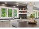 Bright kitchen features a large window, white cabinets, and open shelving at 9940 Koupela Dr, Raleigh, NC 27614