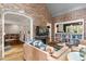 View of open floor plan, living room shows fireplace, built-ins, and hardwood floors at 9940 Koupela Dr, Raleigh, NC 27614
