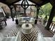 Cozy outdoor living space featuring comfortable seating and ambient lighting at 9940 Koupela Dr, Raleigh, NC 27614