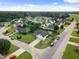 An aerial view showing a well-planned neighborhood with mature trees and green spaces at 10 Oxford Dr, Angier, NC 27501