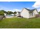 Spacious backyard with an above-ground pool, patio, and lush green lawn at 10 Oxford Dr, Angier, NC 27501