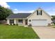 Charming one-story home with a well-maintained lawn and a cozy front porch sitting area at 10 Oxford Dr, Angier, NC 27501