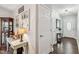 Hallway featuring a decorative table, display case, and multiple doors at 10 Oxford Dr, Angier, NC 27501