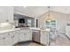 Kitchen with stainless steel appliances, stone countertops, and open layout to the dining and living area at 10 Oxford Dr, Angier, NC 27501