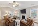 Inviting living room with a fireplace, vaulted ceiling, ceiling fan and plenty of natural light at 10 Oxford Dr, Angier, NC 27501