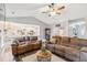Spacious living room with vaulted ceiling, comfortable seating, and open access to kitchen area at 10 Oxford Dr, Angier, NC 27501