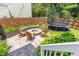 Cozy backyard features a fire pit, chairs, and a trampoline, perfect for outdoor relaxation and entertainment at 100 Fountain Springs Rd, Holly Springs, NC 27540