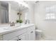 Well-lit bathroom with dual sinks, a large mirror, and ample storage at 100 Fountain Springs Rd, Holly Springs, NC 27540