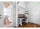 Cozy office nook with custom built-ins, a desk, and direct access to the porch at 100 Fountain Springs Rd, Holly Springs, NC 27540