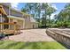 Charming backyard featuring a patio, professional landscaping, grass, fire pit, and a well-maintained lawn at 1005 Enderbury Dr, Raleigh, NC 27614