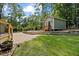 Charming backyard with a shed, patio, and lush lawn, perfect for outdoor relaxation and entertaining at 1005 Enderbury Dr, Raleigh, NC 27614