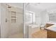 Beautiful bathroom featuring a glass shower and separate soaking tub and dual vanities at 1005 Enderbury Dr, Raleigh, NC 27614