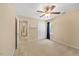 Neutral bedroom with a ceiling fan, a large window, and carpeting at 1005 Enderbury Dr, Raleigh, NC 27614
