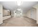 Large bonus room featuring plush carpeting, neutral paint, and windows for natural light at 1005 Enderbury Dr, Raleigh, NC 27614