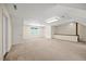 Spacious bonus room with neutral carpet, bright natural light, and ample space for versatile use at 1005 Enderbury Dr, Raleigh, NC 27614