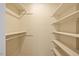 Walk-in closet featuring built-in shelving and ample storage space at 1005 Enderbury Dr, Raleigh, NC 27614