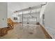 Spacious garage with two overhead doors, ample storage space, and stairs to upper level at 1005 Enderbury Dr, Raleigh, NC 27614
