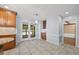 Spacious kitchen showcasing wood cabinets, granite countertops, stainless steel appliances and deck access at 1005 Enderbury Dr, Raleigh, NC 27614