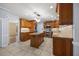 Open kitchen with a granite island, stainless steel appliances, and tiled flooring at 1005 Enderbury Dr, Raleigh, NC 27614