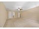 Bright main bedroom boasts plush carpeting and access to the attached ensuite bathroom at 1005 Enderbury Dr, Raleigh, NC 27614