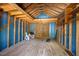 Unfinished shed interior with exposed wooden beams and blue accents ready for a custom design at 1005 Enderbury Dr, Raleigh, NC 27614