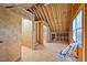 Interior view of unfinished room with exposed wood framework, showcasing construction and potential for customization at 1005 Enderbury Dr, Raleigh, NC 27614